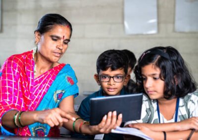 good will trust teacher teaching with tablet